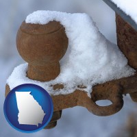 georgia map icon and a rusty, snow-covered trailer hitch
