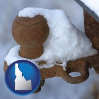 idaho map icon and a rusty, snow-covered trailer hitch