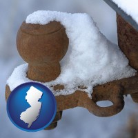 new-jersey map icon and a rusty, snow-covered trailer hitch