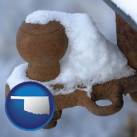 oklahoma map icon and a rusty, snow-covered trailer hitch