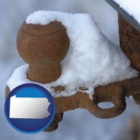 pennsylvania map icon and a rusty, snow-covered trailer hitch