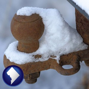 a rusty, snow-covered trailer hitch - with Washington, DC icon
