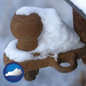 a rusty, snow-covered trailer hitch - with Kentucky icon
