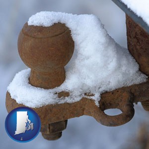 a rusty, snow-covered trailer hitch - with Rhode Island icon
